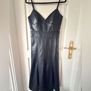 Stunning black faux leather bodycon dress by BCBG Max Azria.